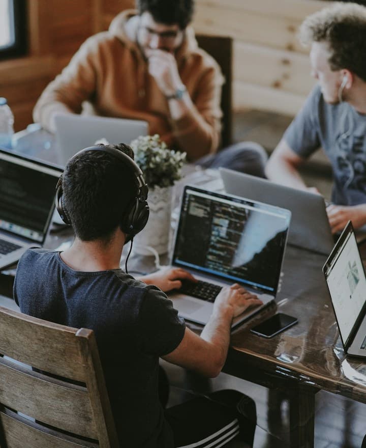 A small team working together on laptops